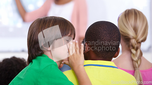 Image of Children, whisper and classroom in ear for secret, gossip or communication in lesson at school. Person, students or friends listening to rumor, information or eavesdrop in class together with teacher