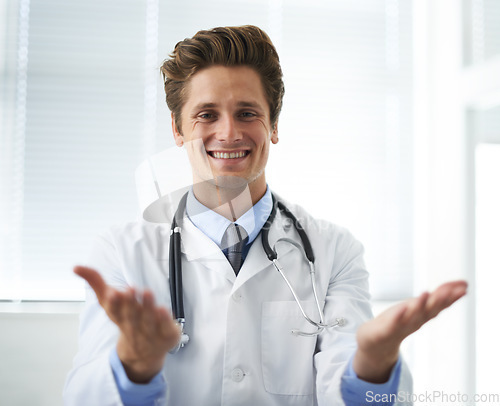 Image of Welcome, smile and man doctor in office for greeting hello at a medical consultation at clinic. Happy, professional and young male healthcare worker with positive attitude in a medicare hospital.