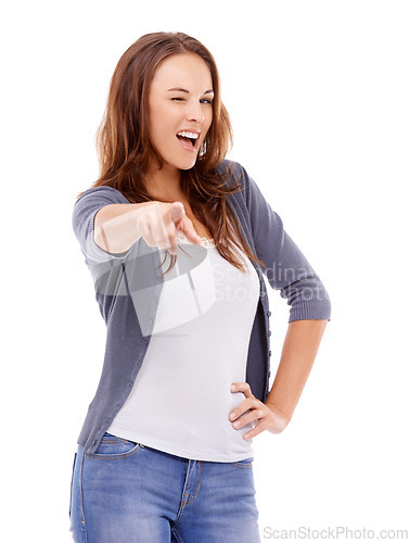 Image of Woman, portrait pointing to you in studio with wink for choice, decision and vote for winner on white background. Happy model, blink and finger emoji for recruitment, hiring and attention for support