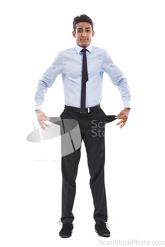 Image of Business man, empty pockets and studio portrait for financial crisis in recession by white background. Entrepreneur, employee and person with no money, stress and inflation in economy, pants and poor
