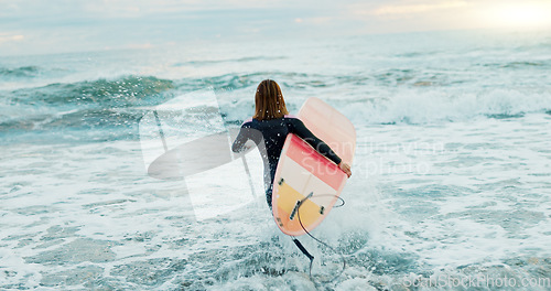 Image of Surfing, beach and woman in water for surfboard for sports, fitness and freedom by ocean. Nature, travel and back of person running in sea for wellness on holiday, vacation and adventure for hobby