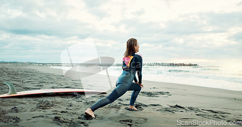 Image of Surfer, woman stretching at beach and fitness for extreme sports with ocean view, waves and travel. Flexibility, warm up and exercise outdoor, surf and nature with surfboard and athlete on adventure