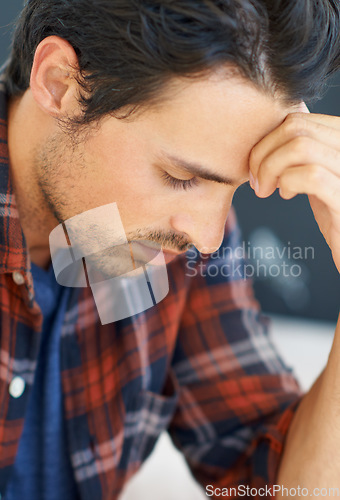 Image of Stress, thinking and man with headache from anxiety in home or closeup of crisis in mental health. Frustrated, person or worry for budget of finance, money or debt and depression in unemployment