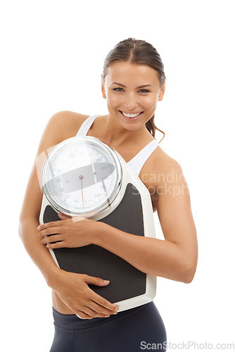 Image of Studio portrait, happiness and woman with scale machine to track weight loss, exercise results or body transformation goals. Wellness, slim or model confident in BMI, diet or mass on white background