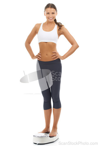 Image of Studio portrait, happy and woman with scale to track weight loss progress, healthy lifestyle change or body goals. Happiness, slimming and person smile for BMI, diet or fitness on white background