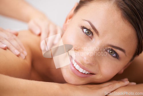 Image of Woman, happy portrait and back massage at spa for beauty, skincare and healing at cosmetics salon. Face, client and smile at wellness resort for acupressure, holistic therapy and shoulder treatment