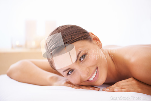 Image of Relax, self care and young woman at spa with body massage for health, wellness and pamper. Happy, natural and female person with calm, peaceful and serene skin therapy treatment at beauty salon.