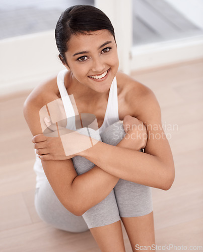 Image of Portrait, fitness and smile of woman on the floor for exercise, yoga or pilates. Happy, healthy body and a young person at home for physical activity, holistic wellness or relax in top view in Brazil