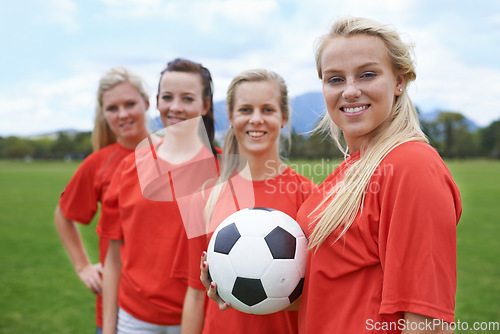 Image of Woman, soccer players and portrait with ball, happy and football field for match, competition or game. Fitness, practice and ready for training, outdoor and exercise for athlete, confident or sport