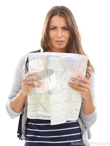 Image of Map, confused and woman reading in studio for hiking adventure, weekend trip or vacation. Travel, discover and portrait of person with paper directions for tourism and navigation by white background.