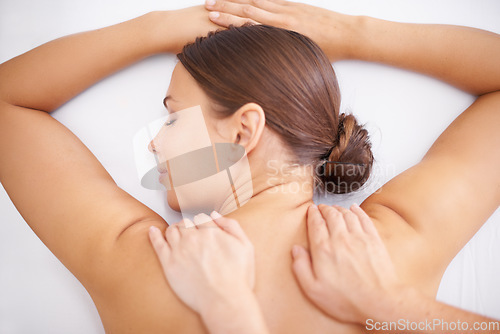 Image of Top of woman, back massage and hands of masseuse in spa, aromatherapy and healing with wellness. Calm, natural with skincare, body care and health, holistic treatment for zen or stress relief