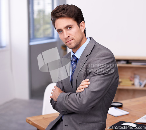 Image of Portrait of businessman at desk with confidence, arms crossed and career in legal inspection at law firm. Attorney, lawyer or business man with modern office job as quality assurance professional.