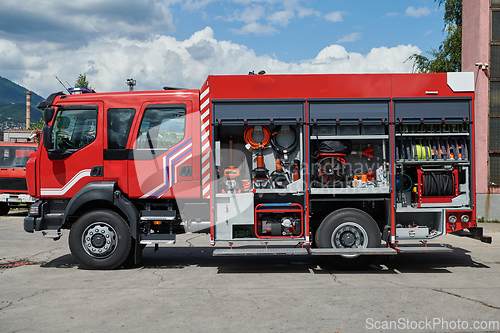 Image of Close-up of essential firefighting equipment on a modern firetruck, showcasing tools and gear ready for emergency response to hazardous fire situations