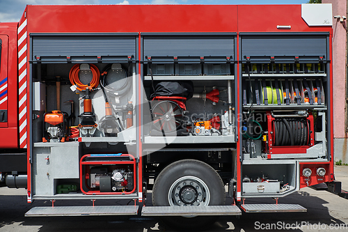 Image of Close-up of essential firefighting equipment on a modern firetruck, showcasing tools and gear ready for emergency response to hazardous fire situations