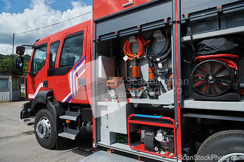 Image of Close-up of essential firefighting equipment on a modern firetruck, showcasing tools and gear ready for emergency response to hazardous fire situations