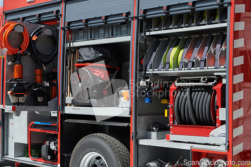 Image of Close-up of essential firefighting equipment on a modern firetruck, showcasing tools and gear ready for emergency response to hazardous fire situations