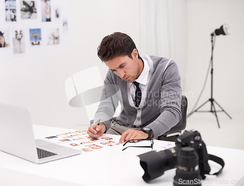 Image of Photographer, thinking and man editing in office with computer to process, production and catelog images. Professional, editor and creative person with laptop and photoshoot results of cinematography