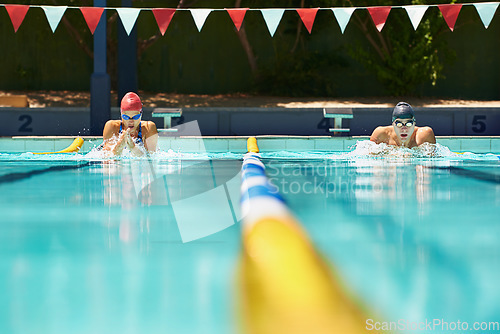 Image of Sports, event or people in swimming pool for competition training, workout or fitness together. Fast, water or cardio with swimmers and athletes for exercise, championship and race at gala in summer