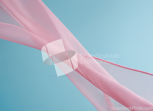 Image of Flying pink fabric wave isolated on blue background