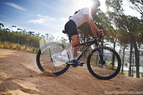 Image of Man, cyclist and bicycle on mountain, exercise and training with energy, bike and cycling sport. Outdoor, hobby and fitness in nature, trail and active for wellness, helmet and physical workout