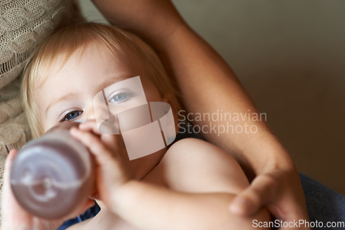 Image of Relax, portrait and baby drinking bottle and laying with mother for nap time with refreshing tea. Cute, sweet and infant, kid or toddler enjoying beverage for nutrition, health and child development.