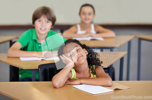 Image of Sleepy, children and bored of learning, education or books from adhd, burnout or frustrated with mindset in school. Exhausted, girl or thinking of studying, group or problem with fatigue in classroom