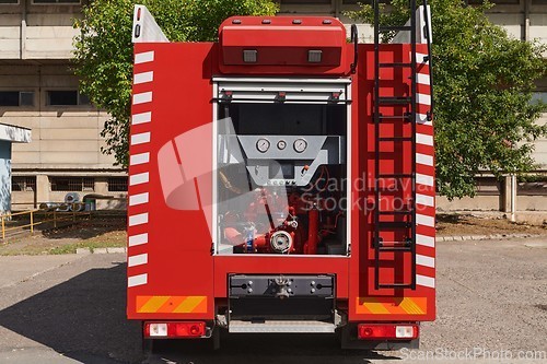 Image of Close-up of essential firefighting equipment on a modern firetruck, showcasing tools and gear ready for emergency response to hazardous fire situations