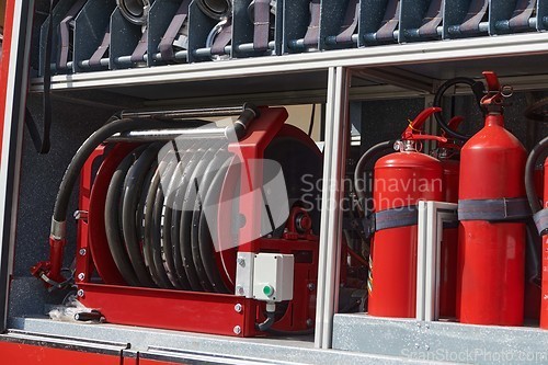 Image of Close-up of essential firefighting equipment on a modern firetruck, showcasing tools and gear ready for emergency response to hazardous fire situations
