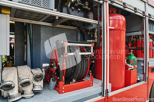 Image of Close-up of essential firefighting equipment on a modern firetruck, showcasing tools and gear ready for emergency response to hazardous fire situations