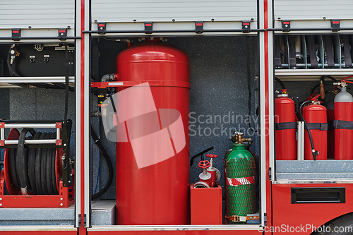 Image of Close-up of essential firefighting equipment on a modern firetruck, showcasing tools and gear ready for emergency response to hazardous fire situations