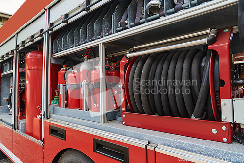 Image of Close-up of essential firefighting equipment on a modern firetruck, showcasing tools and gear ready for emergency response to hazardous fire situations