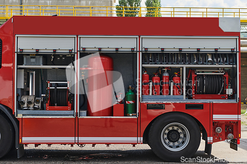 Image of Close-up of essential firefighting equipment on a modern firetruck, showcasing tools and gear ready for emergency response to hazardous fire situations