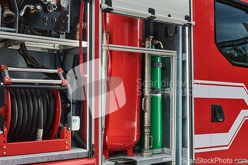 Image of Close-up of essential firefighting equipment on a modern firetruck, showcasing tools and gear ready for emergency response to hazardous fire situations
