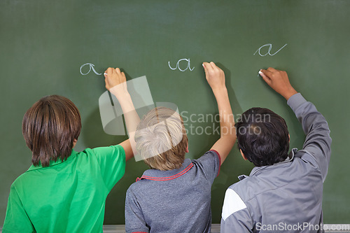 Image of Children, chalkboard and school writing with education, cursive and answer for learning. Back, knowledge and youth development in a study lesson with students in classroom with chalk and solution