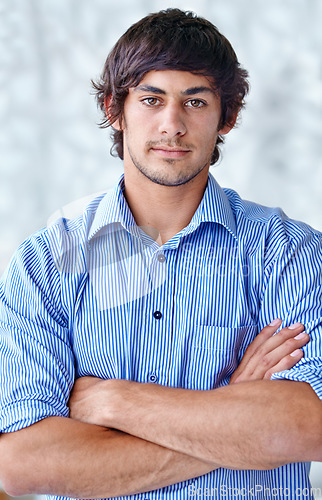 Image of Portrait, arms folded and man with confidence in career and wellness in studio background. Person, pride and face of entrepreneur in ambition in start up company and it professional in silicon valley