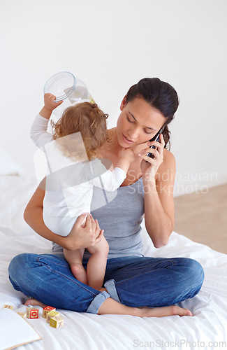 Image of Phone call, playing and mother with baby on bed for communication and bonding together at modern house. Discussion, fun and young mom on mobile conversation and holding toddler in bedroom at home.