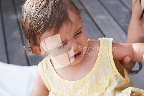 Image of Baby, girl and unhappy or crying outside on porch, sad and upset for mistake or fail in childhood. Kid, toddler and frustration and distress for info, autism and overstimulation or adhd in outdoors