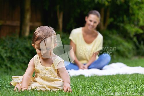 Image of Mother, baby and playing together in outdoors for bonding, love and affection or curious in childhood. Mom, toddler and happy girl or child and relaxing outside, learning and security in relationship