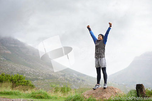 Image of Athlete, mountain peak space or hands up for celebration in training, exercise or workout success. Excited man, sky mockup or hiker with fun energy, gratitude or freedom in nature for fitness goals