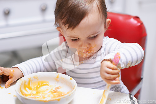 Image of Eating, vitamins and boy baby in chair with vegetable food for child development at home. Organic, nutrition and sweet hungry kid or toddler enjoying healthy lunch, dinner or supper meal at house.