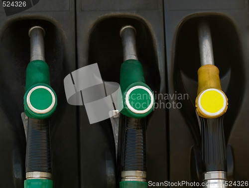 Image of Green and yellow gas  pump rack