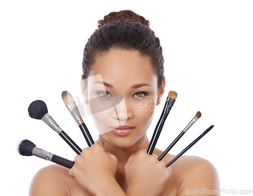 Image of Woman, portrait and makeup brushes for cosmetics in studio, choice and decision for beauty. Female model person, tools and equipment for application, skincare and facial treatment by white background