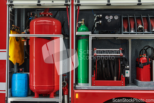 Image of Close-up of essential firefighting equipment on a modern firetruck, showcasing tools and gear ready for emergency response to hazardous fire situations