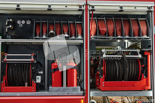 Image of Close-up of essential firefighting equipment on a modern firetruck, showcasing tools and gear ready for emergency response to hazardous fire situations