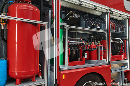 Image of Close-up of essential firefighting equipment on a modern firetruck, showcasing tools and gear ready for emergency response to hazardous fire situations