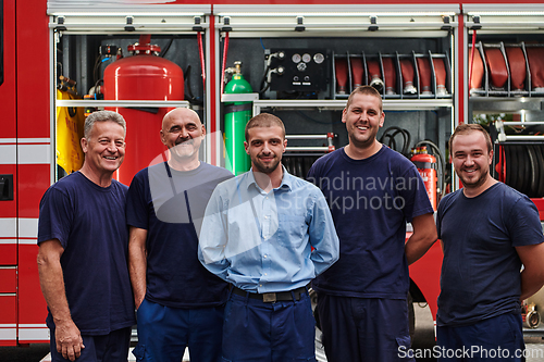 Image of A skilled and dedicated professional firefighting team proudly poses in front of their state of the art firetruck, showcasing their modern equipment and commitment to ensuring public safety.