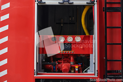 Image of Close-up of essential firefighting equipment on a modern firetruck, showcasing tools and gear ready for emergency response to hazardous fire situations