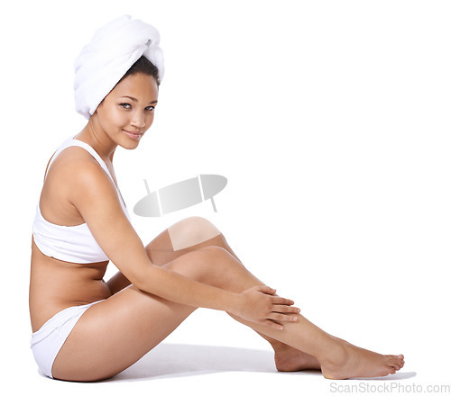 Image of Happy woman, legs and skincare in studio portrait for hair removal results and beauty on floor on a white background. Young person or model in underwear with body cosmetics, dermatology and hygiene