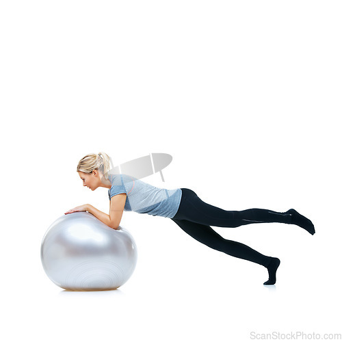 Image of Woman, gym ball or balance in studio for workout, wellness or mobility exercise on white background. Female athlete, training equipment or fitness for mockup space, stretching legs or flexibility