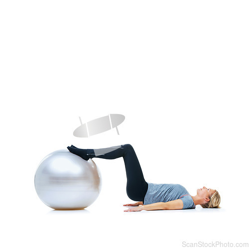 Image of Woman, fitness and exercise ball for training, workout or health and wellness against a white studio background. Active female person or athlete on round object, gym floor or pilates on mockup space